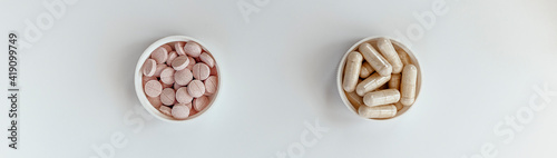 banner: close-up of vitamin B-12 (methylcobalamin+dibencozide) chewable tablets and vitamin B6 (pyridoxal-5-phosphate) capsules. dietary concept. dietary supplement topview photo