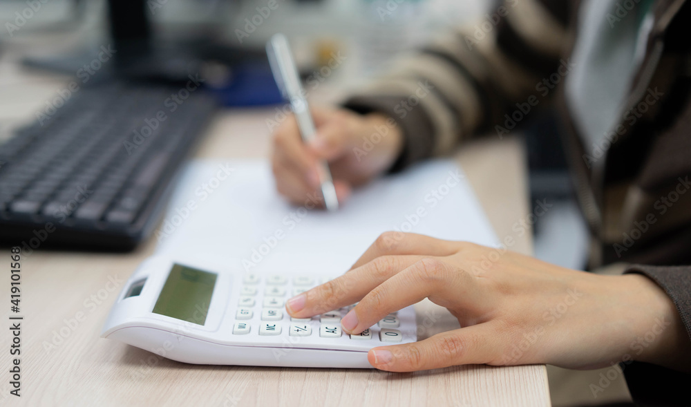 close up on finger hand press on calculator for computing for working woman concept close up on finger hand press on calculator for computing for working woman concept