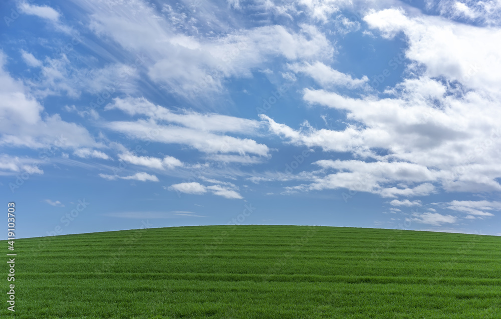 Beautiful green hill , blue sky and clouds in nature , Scotland Beautiful green hill , blue sky and clouds in nature , Scotland