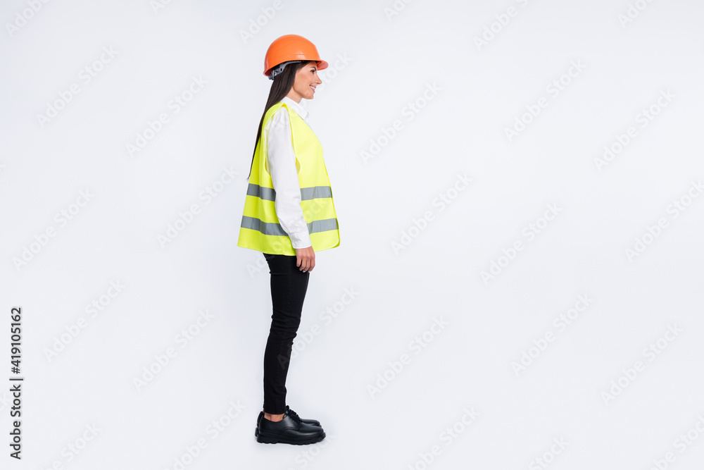 Profile photo of builder lady shiny smile wear helmet shirt vest pants footwear isolated white color background Profile photo of builder lady shiny smile wear helmet shirt vest pants footwear isolated white color background