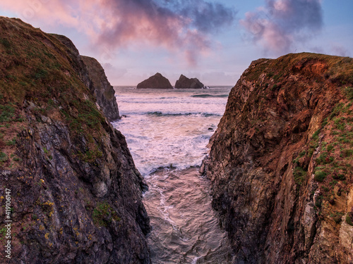 Holywell bay sunset cornwall england uk between the rocks looking at gull rock 