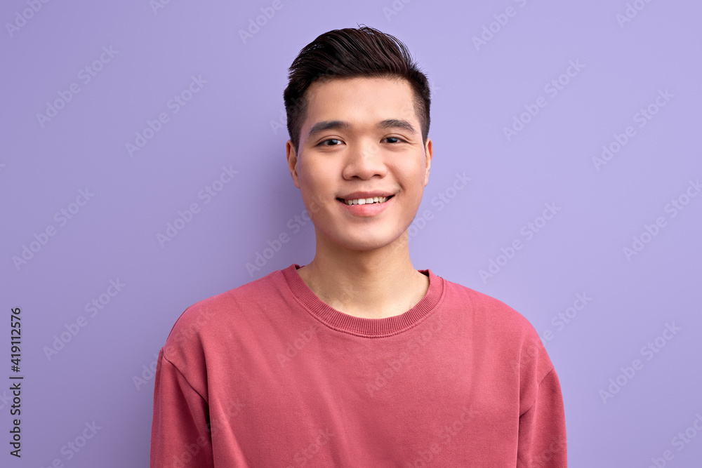Handsome Kind Guy Of Asian Appearance looking at camera Smiling, Wearing Casual Shirt. People and human emotions concept Handsome Kind Guy Of Asian Appearance looking at camera Smiling, Wearing Casual Shirt. People and human emotions concept