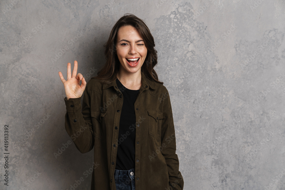 Portrait of happy smiling woman in casual wear standing Portrait of happy smiling woman in casual wear standing