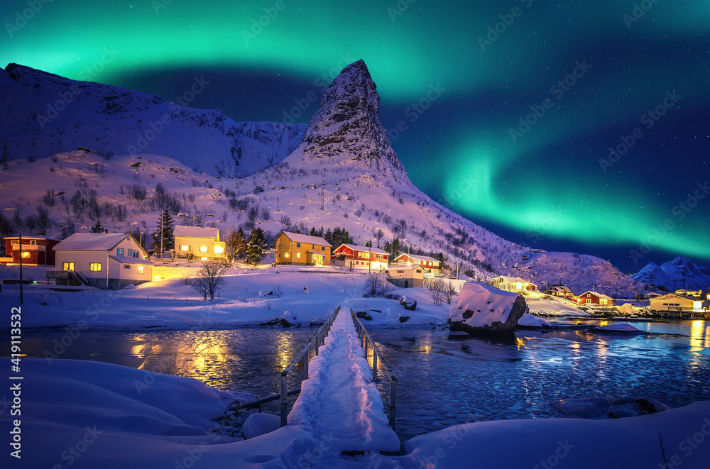 Amazing wintry landscape of Lofoten. Fantastic Winter seascape during sunset. majestic mountains with northern lights. picturesque nature scenery. creative image. Nature background. Traveling concept - obrazy, fototapety, plakaty 
