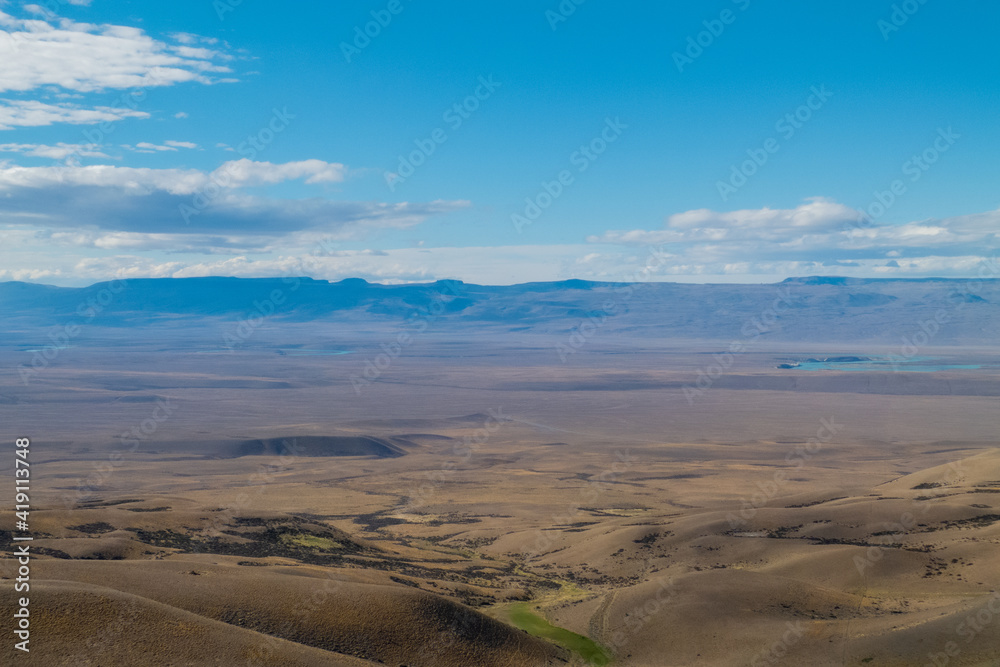 close up view of the landscape from the Tec. Julio Heredia El Monito viewpoint, in calafate, argentina santa cruz, with a view of the hills, water and mountains in the background with beautiful colors close up view of the landscape from the Tec. Julio Heredia El Monito viewpoint, in calafate, argentina santa cruz, with a view of the hills, water and mountains in the background with beautiful colors