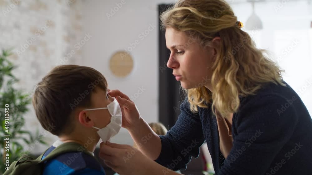 Video of mother preparing child for school in pandemic times. Shot with RED helium camera in 8K Video of mother preparing child for school in pandemic times. Shot with RED helium camera in 8K
