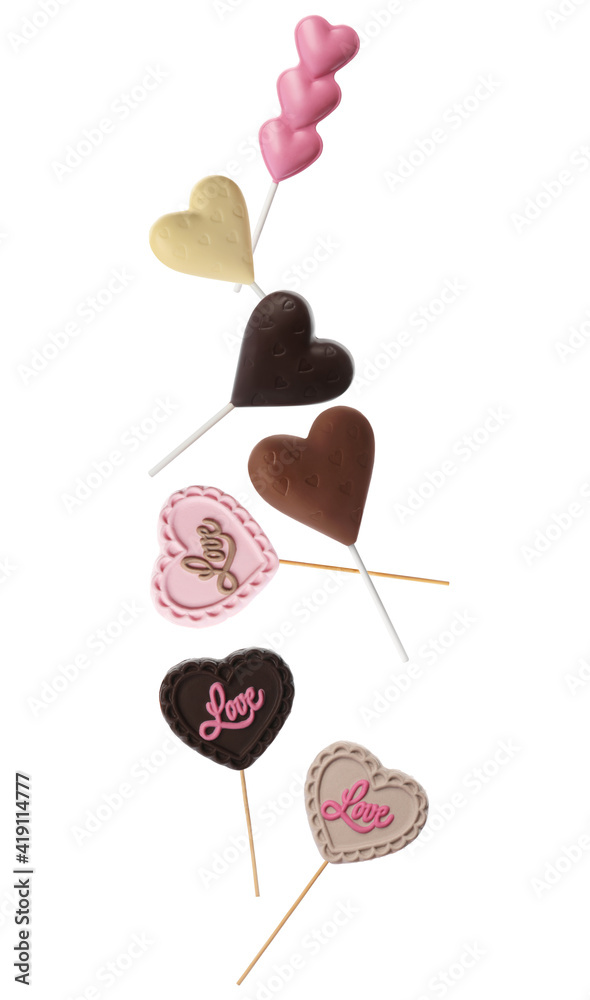 Set with heart shaped lollipops made of chocolate on white background Set with heart shaped lollipops made of chocolate on white background