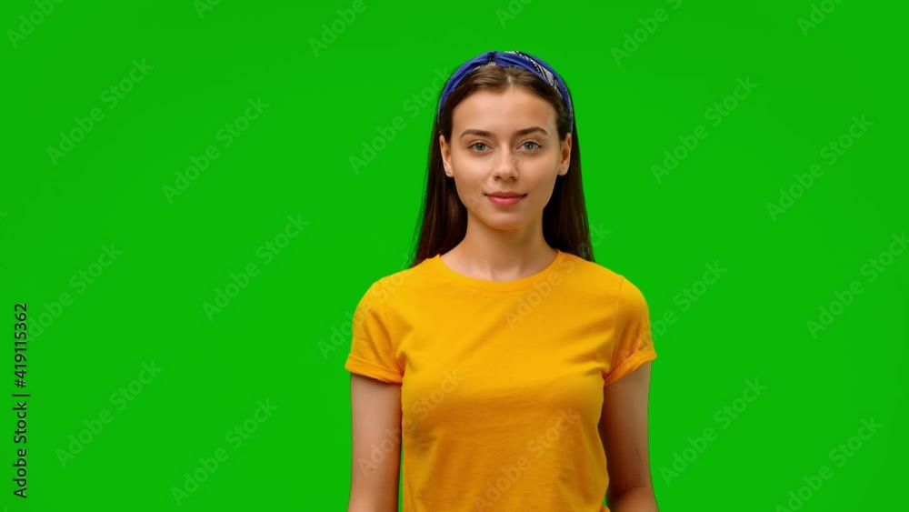 Young girl welcoming, waving hand and saying 