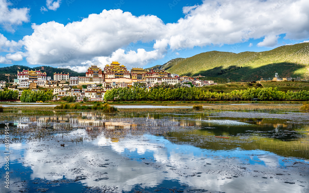 Fototapeta premium Songzanlin monastery panorama with lake and water reflection Shangri-La Yunnan China