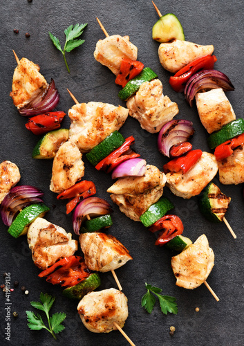 Chicken shashlik and vegetables: peppers, onions, zucchini on skewers. Chicken fillet and grilled vegetables.
