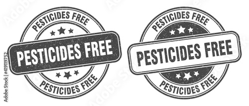 pesticides free stamp. pesticides free label. round grunge sign