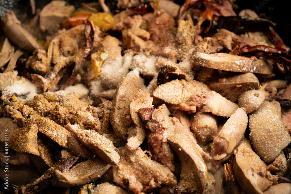 Stir-fried chicken liver and heart with chili peppers, a specialty of Northeast China Stir-fried chicken liver and heart with chili peppers, a specialty of Northeast China
