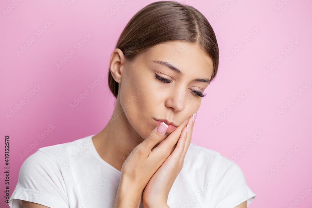 Portrait of a beautiful young woman experiencing a painful toothache Portrait of a beautiful young woman experiencing a painful toothache