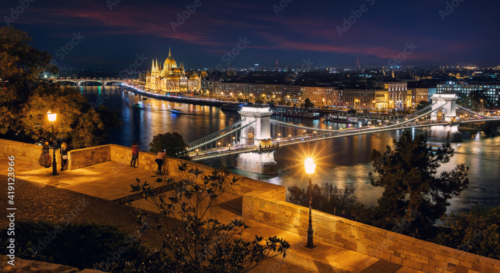 Beautiful evening image of Budapest,  incredible view on Budapest cityscape, with streetlight and colorful sky during sunset. wonderful picturesque Scene. Popular Travel destinations. perfect postcard