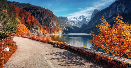 Beautiful landscape mountain forest lake. Amazing autumn view of Grundlsee alpine lake. Great autumn background for design. Colorful scenery in alps. Popular travel and hiking destination. photo