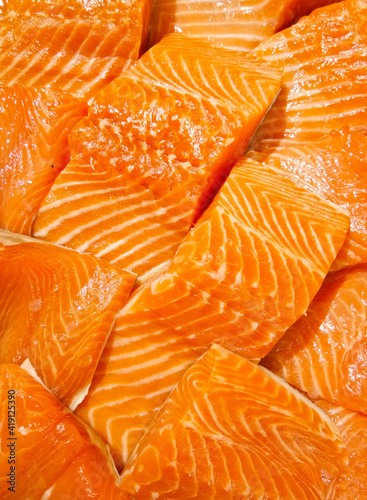 Pile of sliced salmon at fresh seafood market