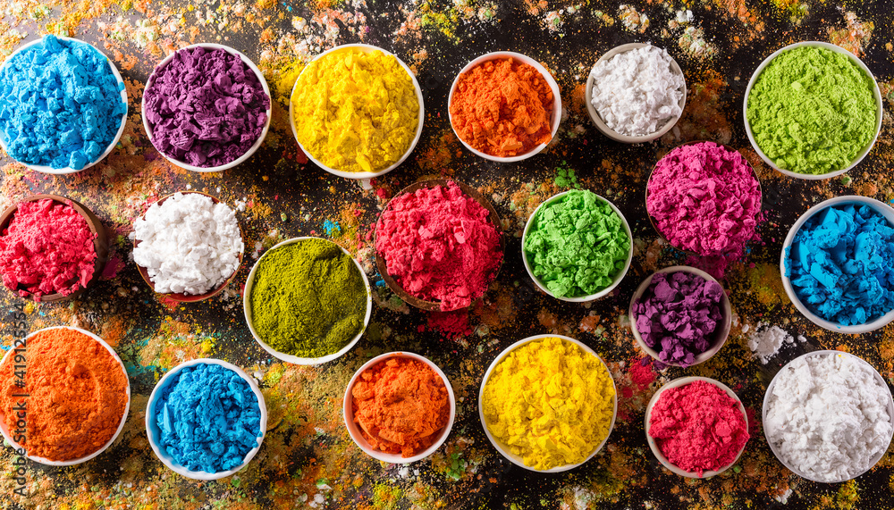 Happy Holi decoration, the indian festival.Top view of colorful holi powder  on dark background. Stock Photo