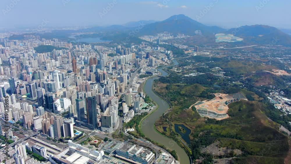 Aerial view over Shenzhen skyline on a beautiful clear day. Aerial view over Shenzhen skyline on a beautiful clear day.