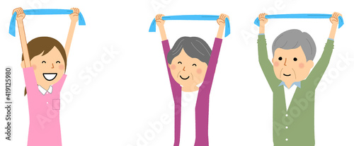 タオル体操をする高齢者