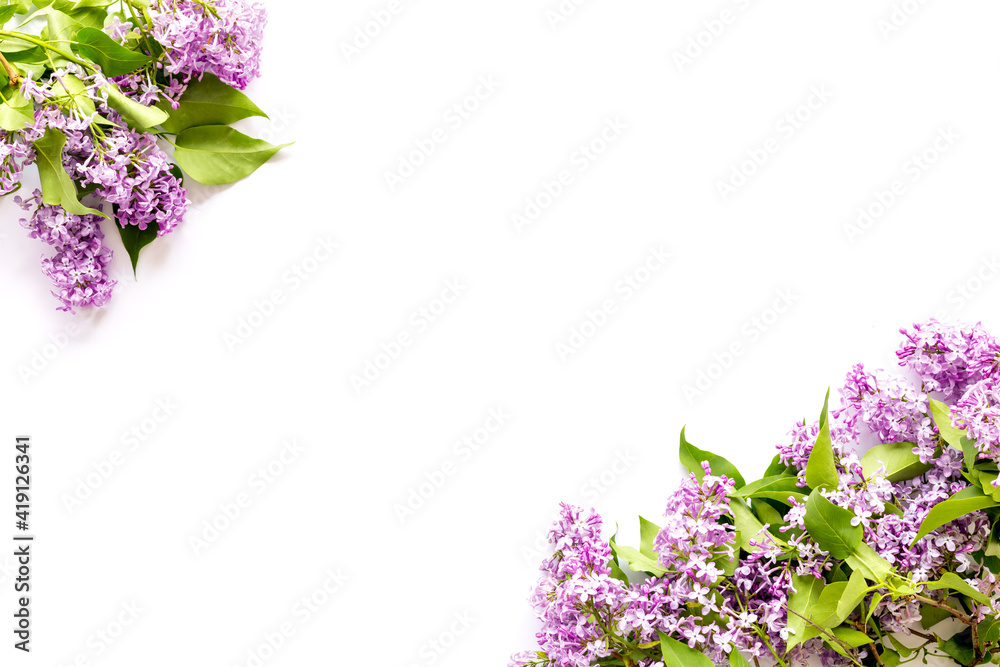 Flat lay of spring lilac flowers. Purple flowers with copy space, top view Flat lay of spring lilac flowers. Purple flowers with copy space, top view
