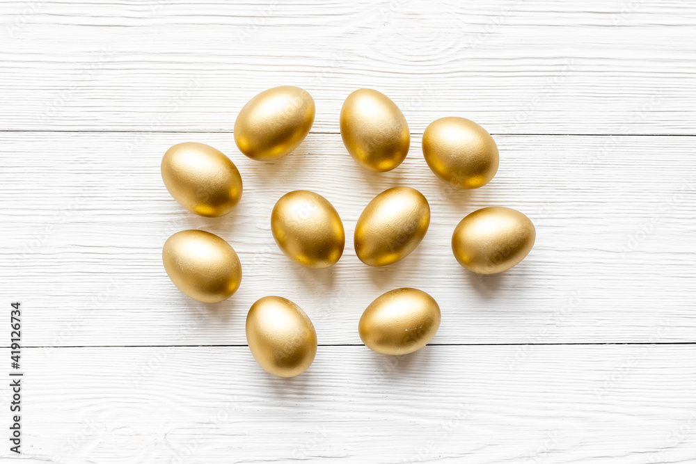 Golden eggs. Easter decoration background. Top view