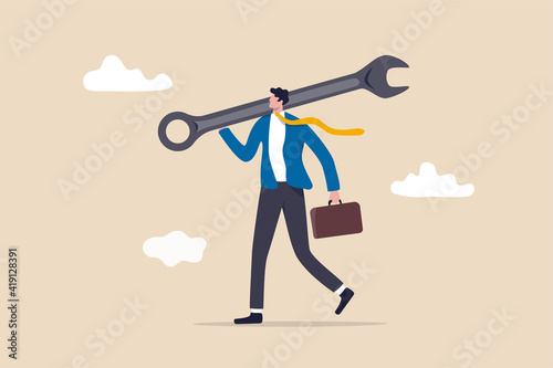 Fix business problem, help resolve problem, improve business in downturn or crisis management concept, smart businessman carrying big wrench metaphor of fixing problem. photo