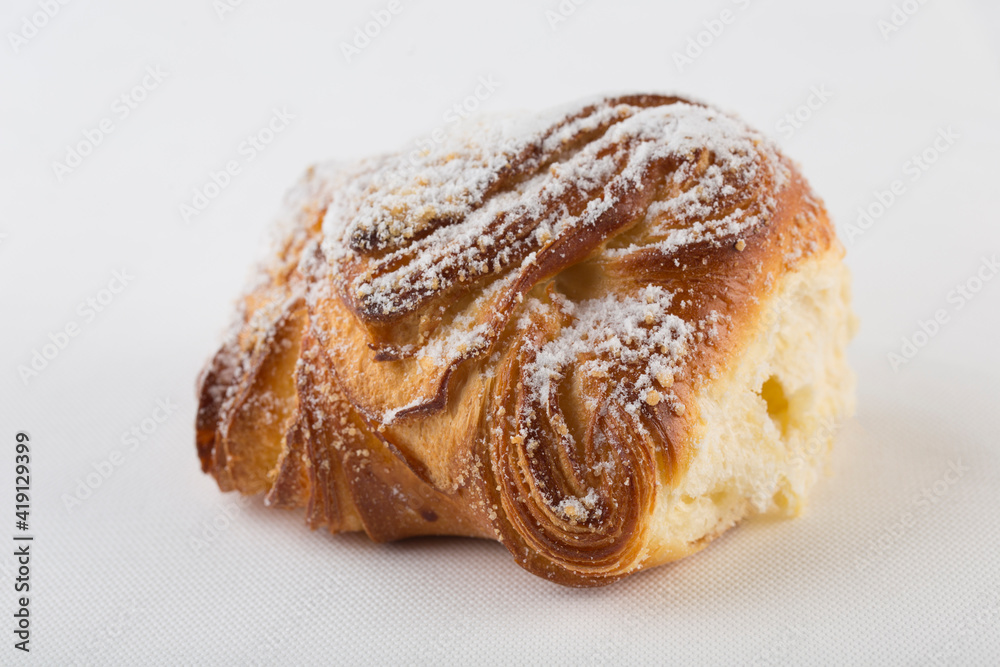 Sweet freshly baked bun on a white background, isolated. Sweet freshly baked bun on a white background, isolated.