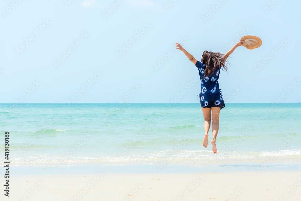Summer vacations. Lifestyle woman relax and chill on beach background. Asia happy young people jumping on the wave sea, summer trips walking enjoy tropical beach Summer vacations. Lifestyle woman relax and chill on beach background. Asia happy young people jumping on the wave sea, summer trips walking enjoy tropical beach