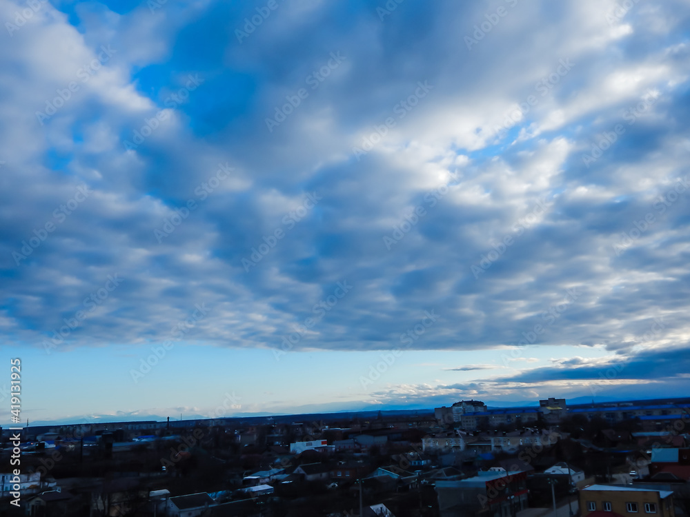 sky in clouds overlooking  the city, sunlight through the clouds!