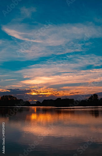 Beautiful sunset with reflections near Plattling, Isar, Bavaria, Germany