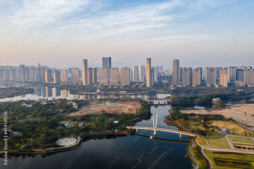 Aerial view of the modern city skyline with bridge and lake, and blue sky, in Xinglin Bay, Jimei District, Xiamen, China