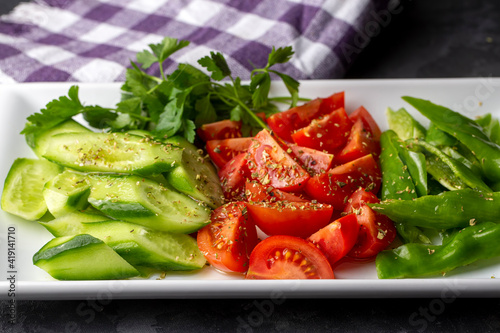 Sliced cucumber, tomato and...
