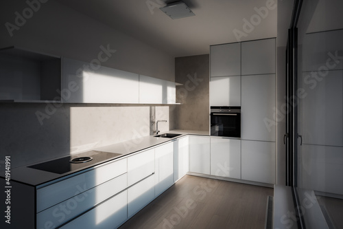 Minimalist kitchen in city apartment during early morning. There are modern appliances and premium materials such as wood glass concrete and stainless steel.On right is balcony window with reflection.