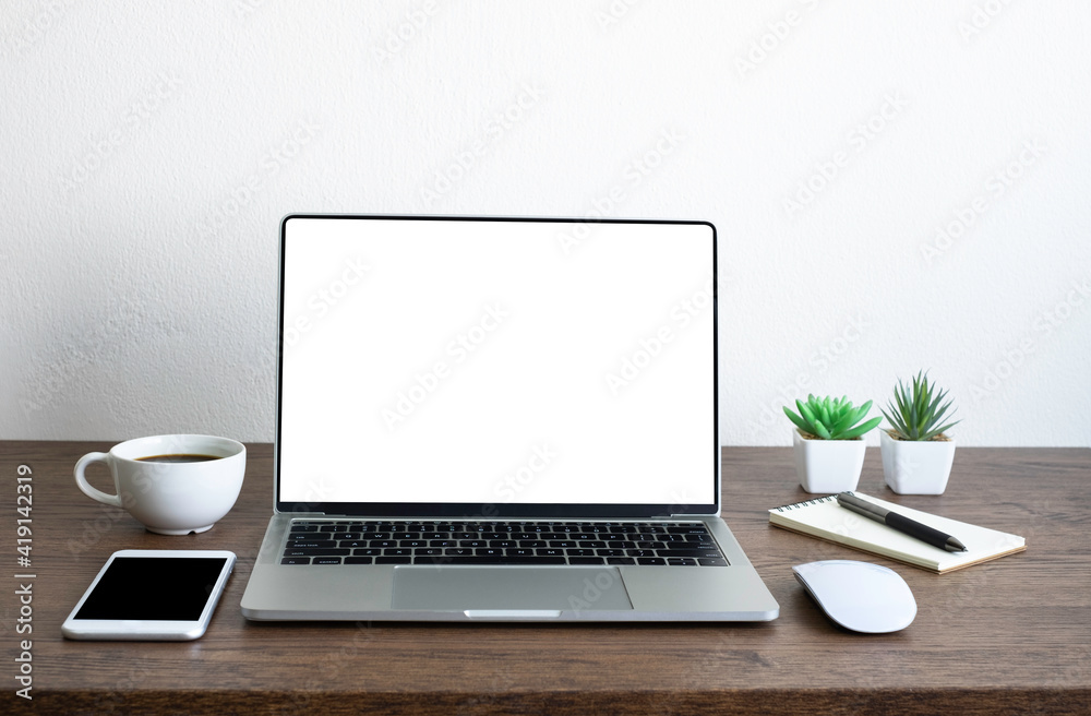 Laptop computer blank screen on wood office desk table with coffee cup and notebook, mouse computer with equipment office supplies. Business and finance concept. Workplace, Flat lay with copy space. Laptop computer blank screen on wood office desk table with coffee cup and notebook, mouse computer with equipment office supplies. Business and finance concept. Workplace, Flat lay with copy space.