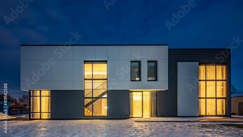 Exterior of luxury private house. Modern cottage at evening.
