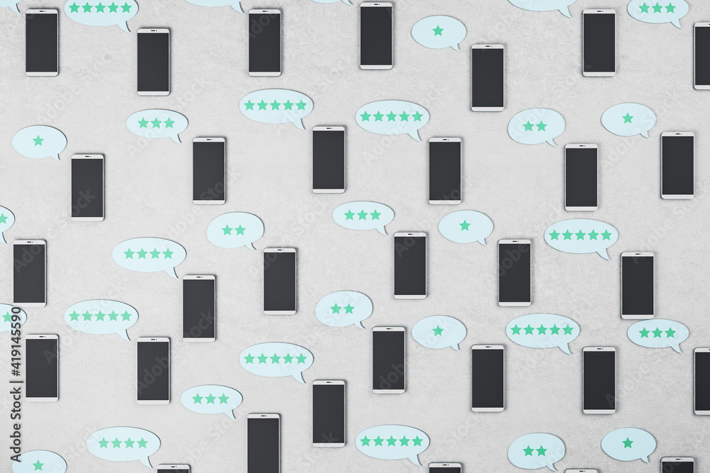 Social network rating concept with black cell phones on concrete surface and speech bubbles with blue stars Social network rating concept with black cell phones on concrete surface and speech bubbles with blue stars