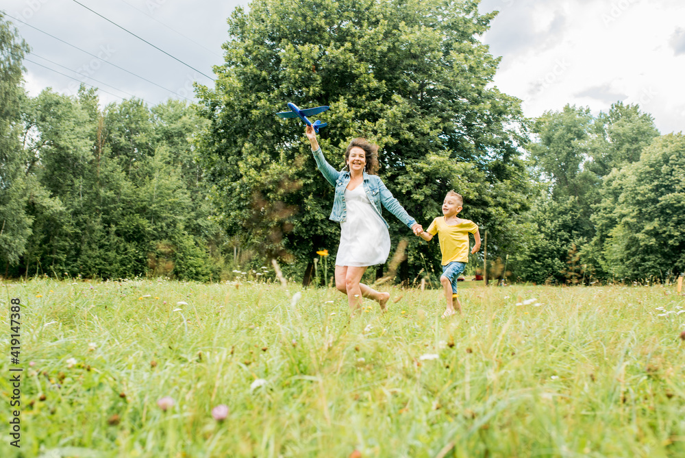 Obraz premium Childhood memories. Active leisure with kids. Kid pilot having fun on meadow. Summer leisure.freedom and dream concept