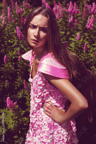 Hot woman in pink dress with flowers