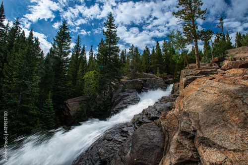 A waterfall along an hiking trail in the Rocky Mountains National Park, in Colorado, USA