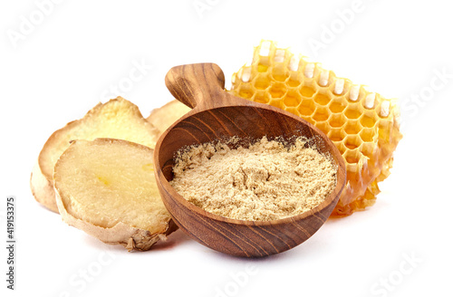 Honeycomb with  ginger  on white background closeup. Honey with spice.