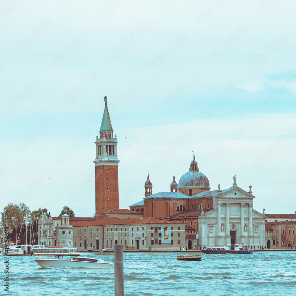 Fototapeta premium view of Church of San Giorgio Maggiore boats before it famous landmark place