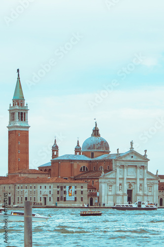view of Church of San Giorgio Maggiore boats before it famous landmark place © phpetrunina14