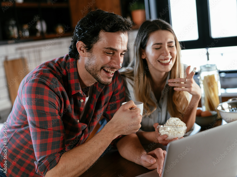 Loving couple drinking coffe in the kitchen. Happy smiling woman enjoy in the morning with her boyfriend. Loving couple drinking coffe in the kitchen. Happy smiling woman enjoy in the morning with her boyfriend.