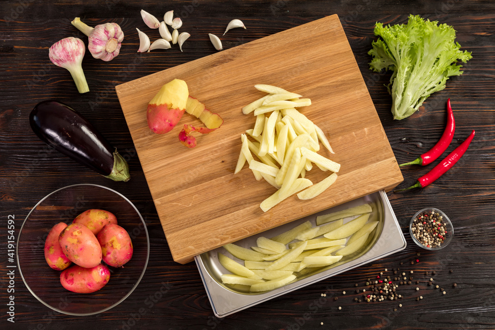 Fresh vegetables, herbs and spices on a cutting board