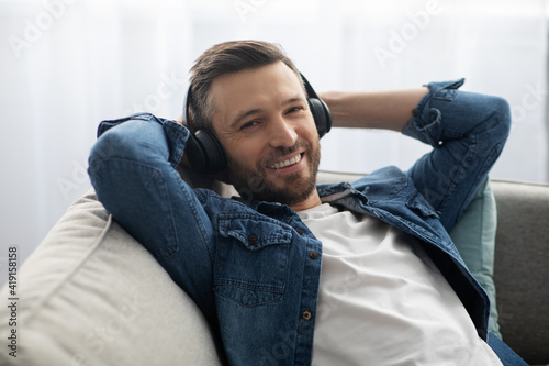 Closeup portrait of bearded man in wireless headset