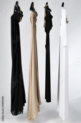 Elegant and trendy women's clothes hanging