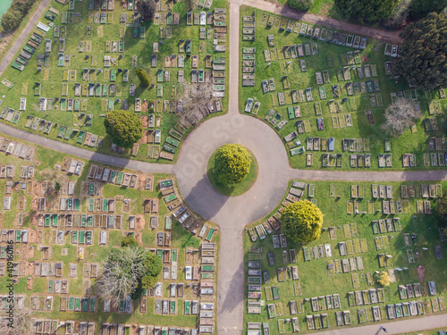 Birds eye view of rows of graves in cemetery graveyard