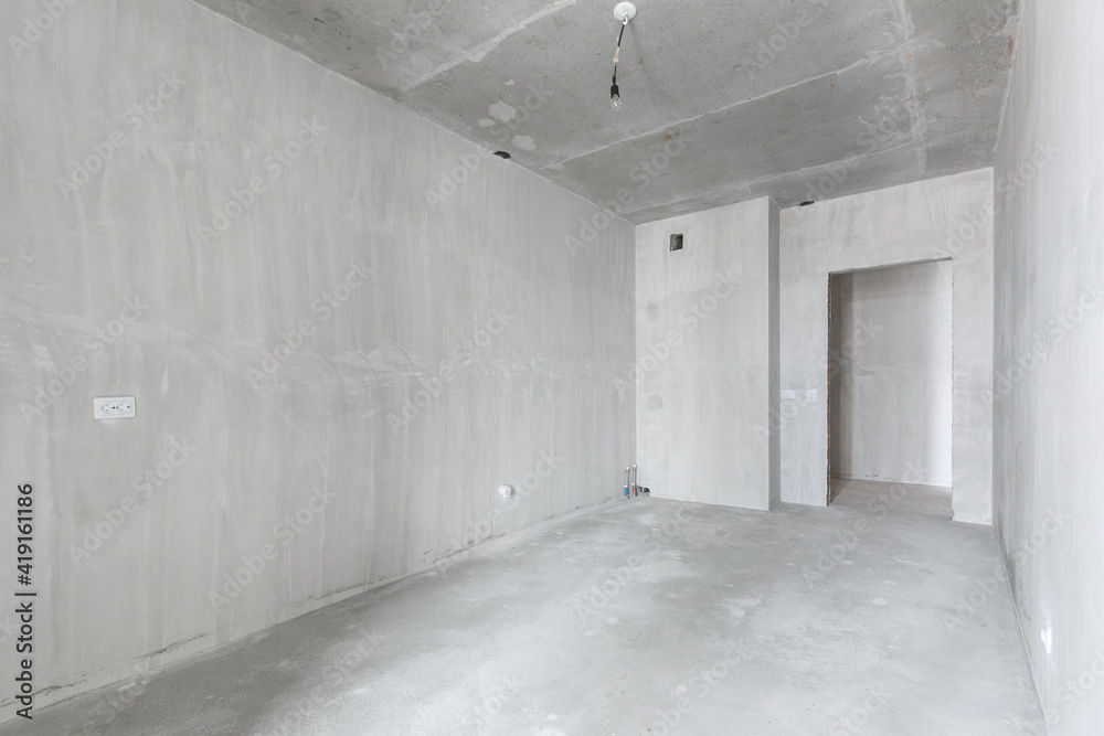 interior of the apartment without decoration in gray colors. rough finish interior of the apartment without decoration in gray colors. rough finish