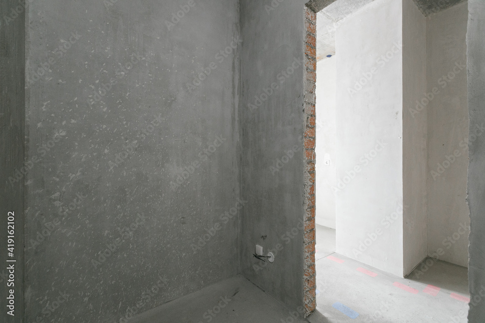 interior of the apartment without decoration in gray colors. rough finish interior of the apartment without decoration in gray colors. rough finish