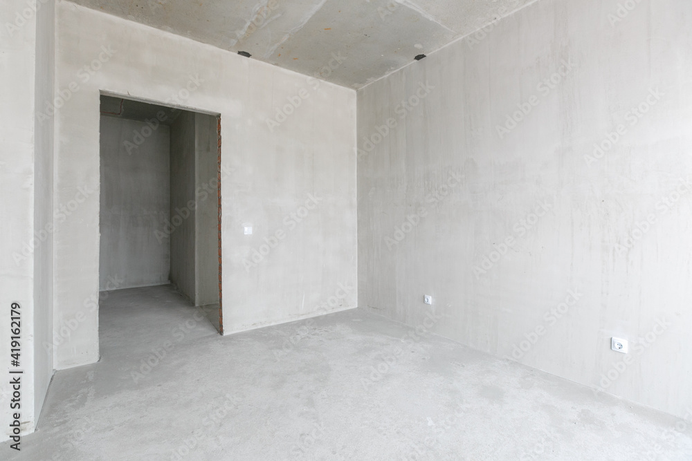 interior of the apartment without decoration in gray colors. rough finish